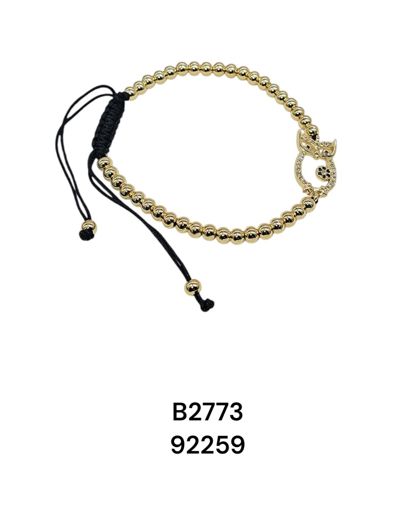 B2773  Brazalete de esferas doradas con un Buho decorado de piedras de colores incrustadas reglable en cordon negro